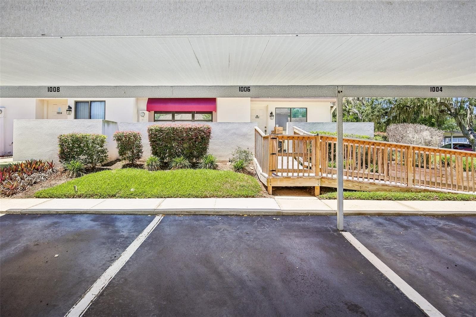 ASSIGNED PARKING SPOT IS COVERED AND CONVENIENTLY LOCATED - 1006 CICERO LN, BRANDON