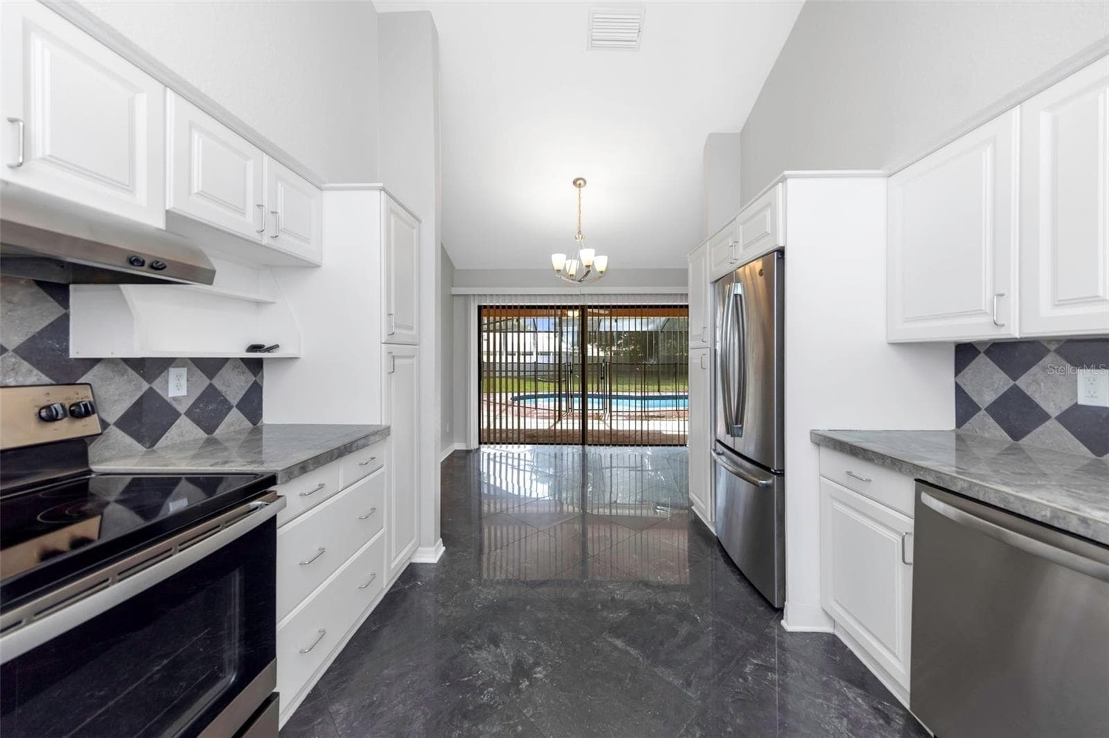 Kitchen - Reverse View - 3334 BRIAN RD N, PALM HARBOR