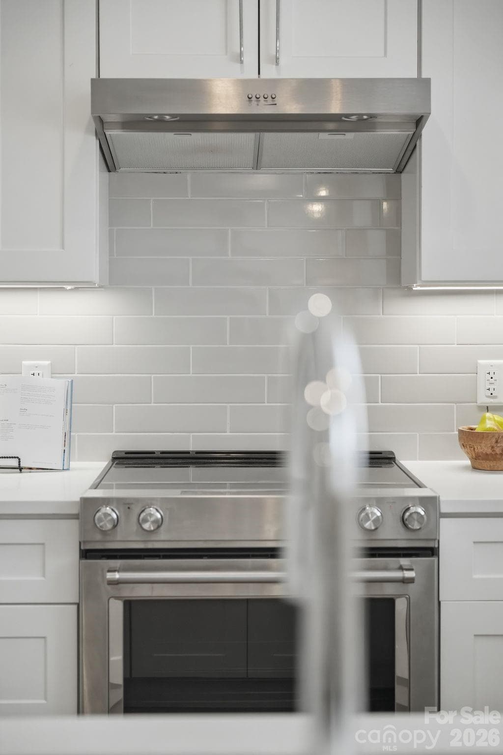 Kitchen shown is from another available residence within The Arches and is intended to showcase the overall design aesthetic, finishes, and material selections featured throughout the development. - Charlotte