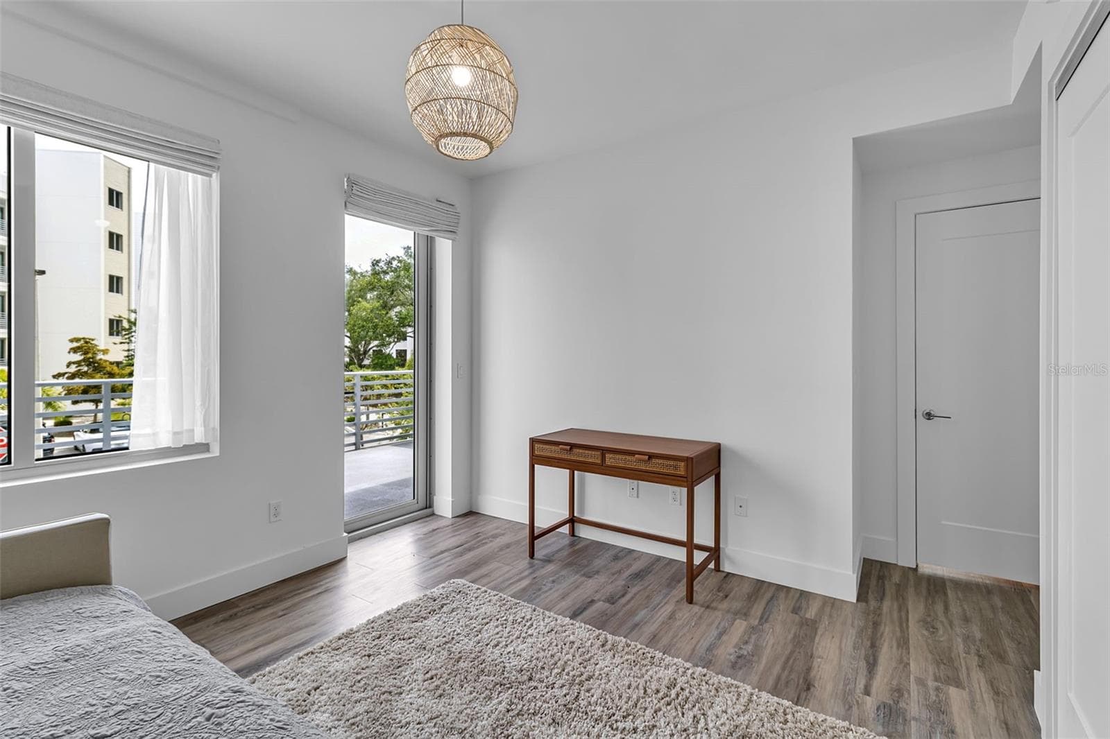 Bedroom 2 with door to balcony - 1703 N TAMIAMI TRL #211, SARASOTA