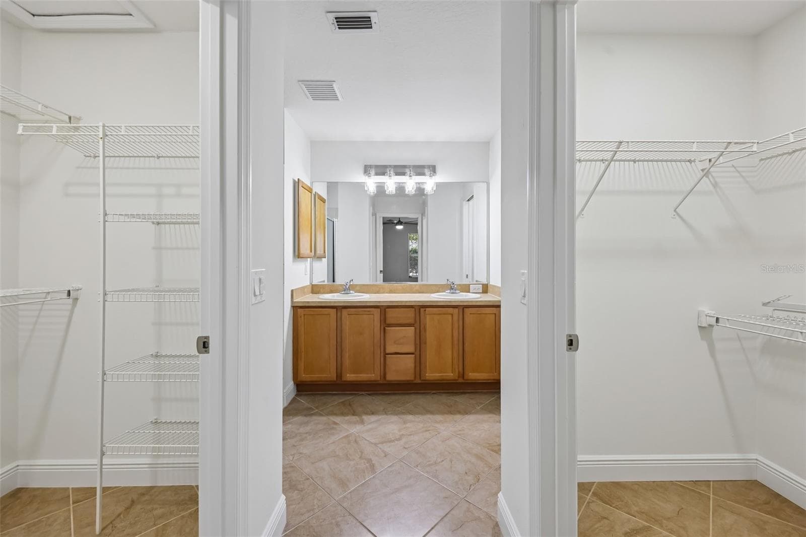 Master Bedroom Closets into Bath - 1000 KENOVA AVE, THE VILLAGES