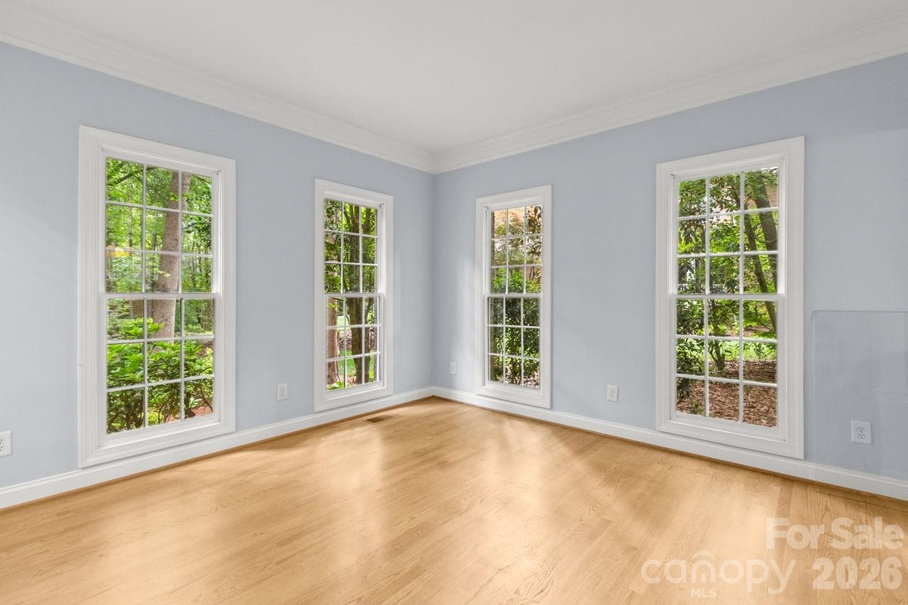 Living room boasts hard wood flooring and plenty of natural light. - 4415 Everclear Court, Charlotte