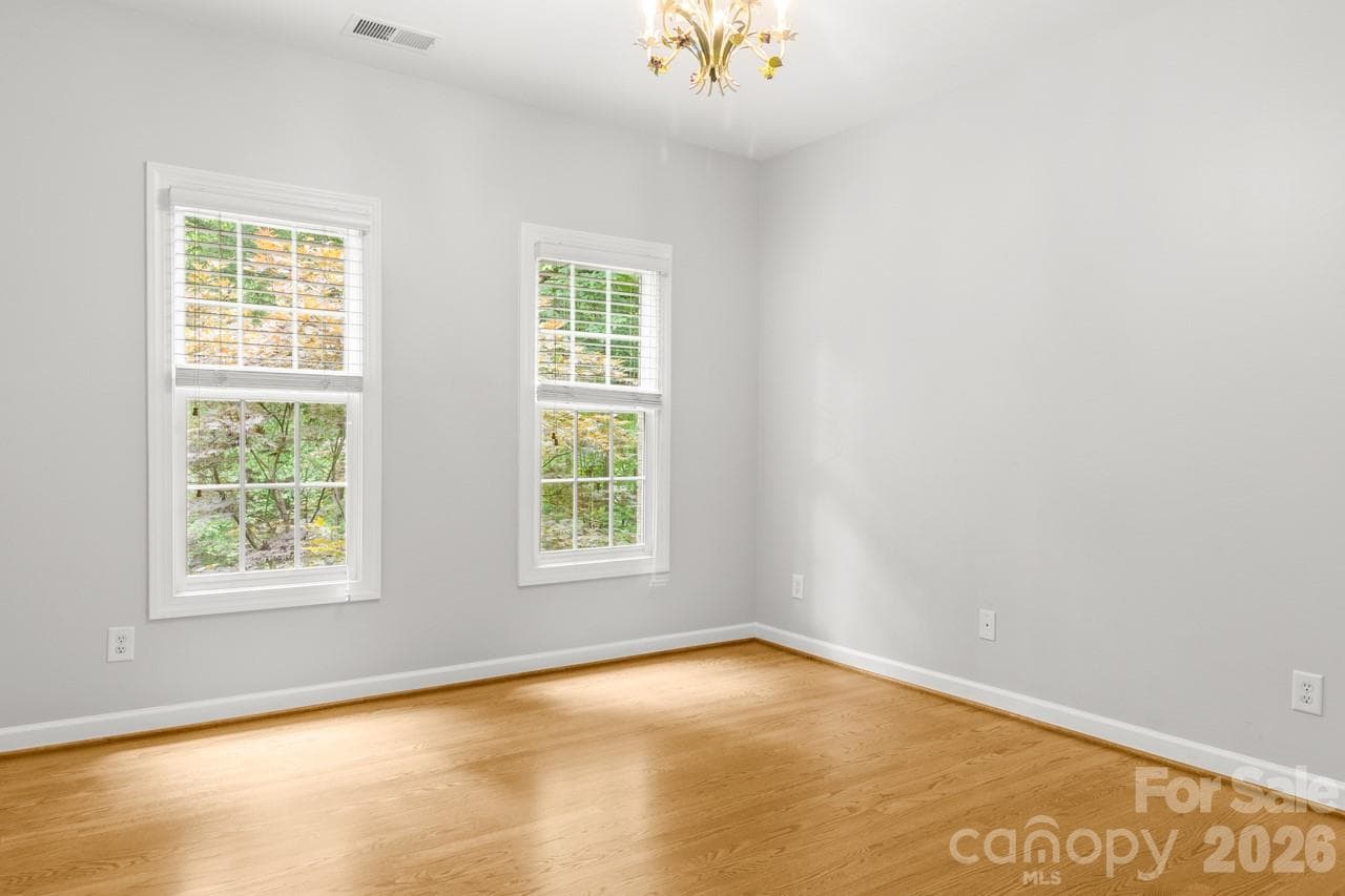 Bedroom 3 continues with the wood flooring. - 4415 Everclear Court, Charlotte