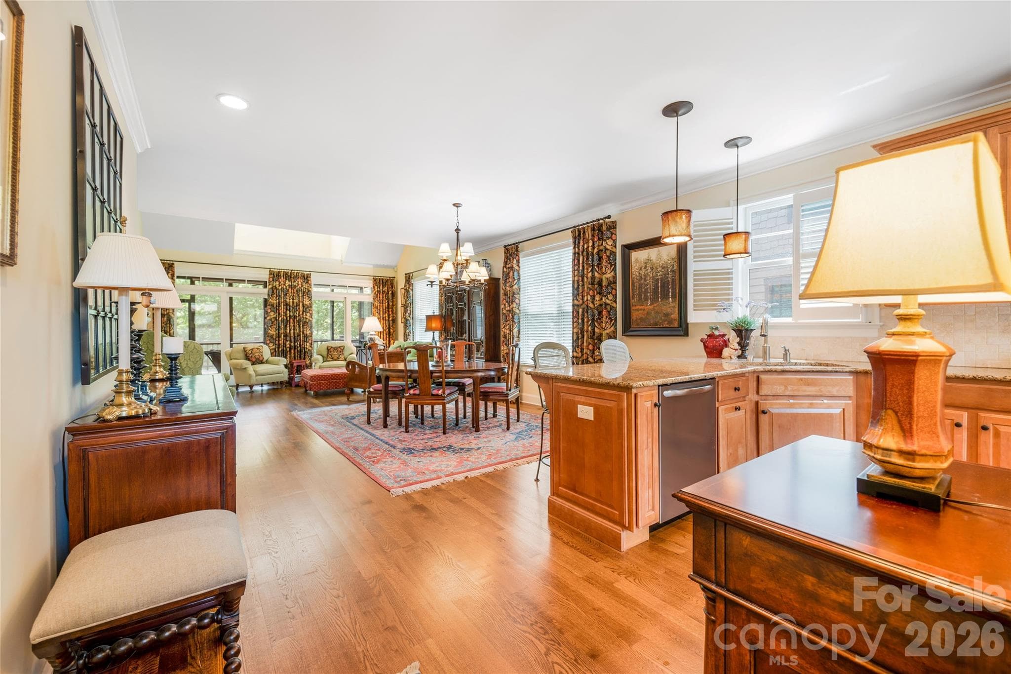 The home features open concept living with kitchen, dining, and living sharing a light filled main level. - 50 Meadow Village Lane, Asheville