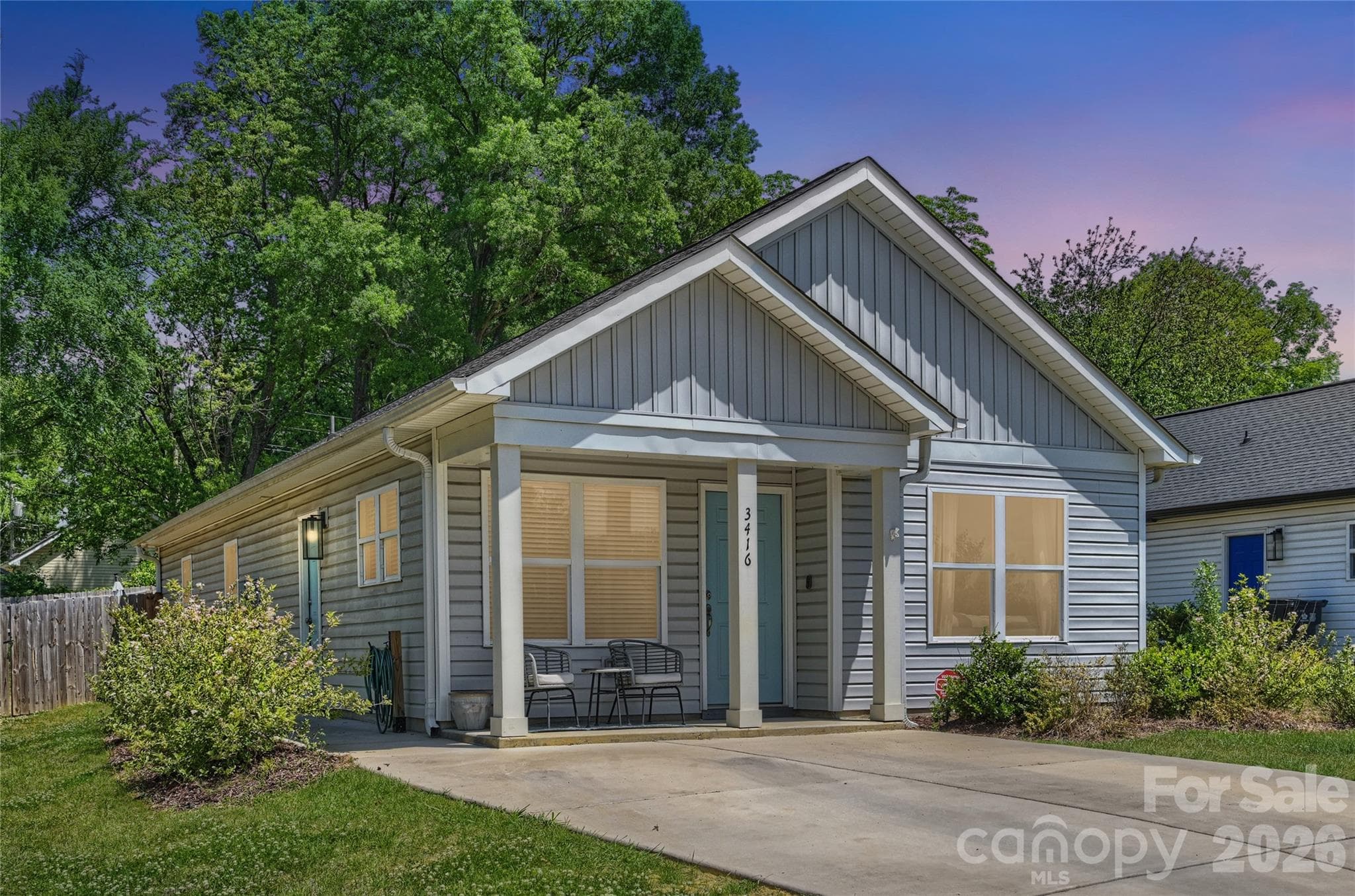 Charming single-level home with welcoming curb appeal and covered front entry. - Charlotte