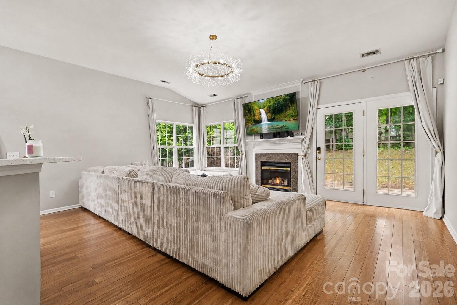 Family room with gas fireplace and french doors - Charlotte