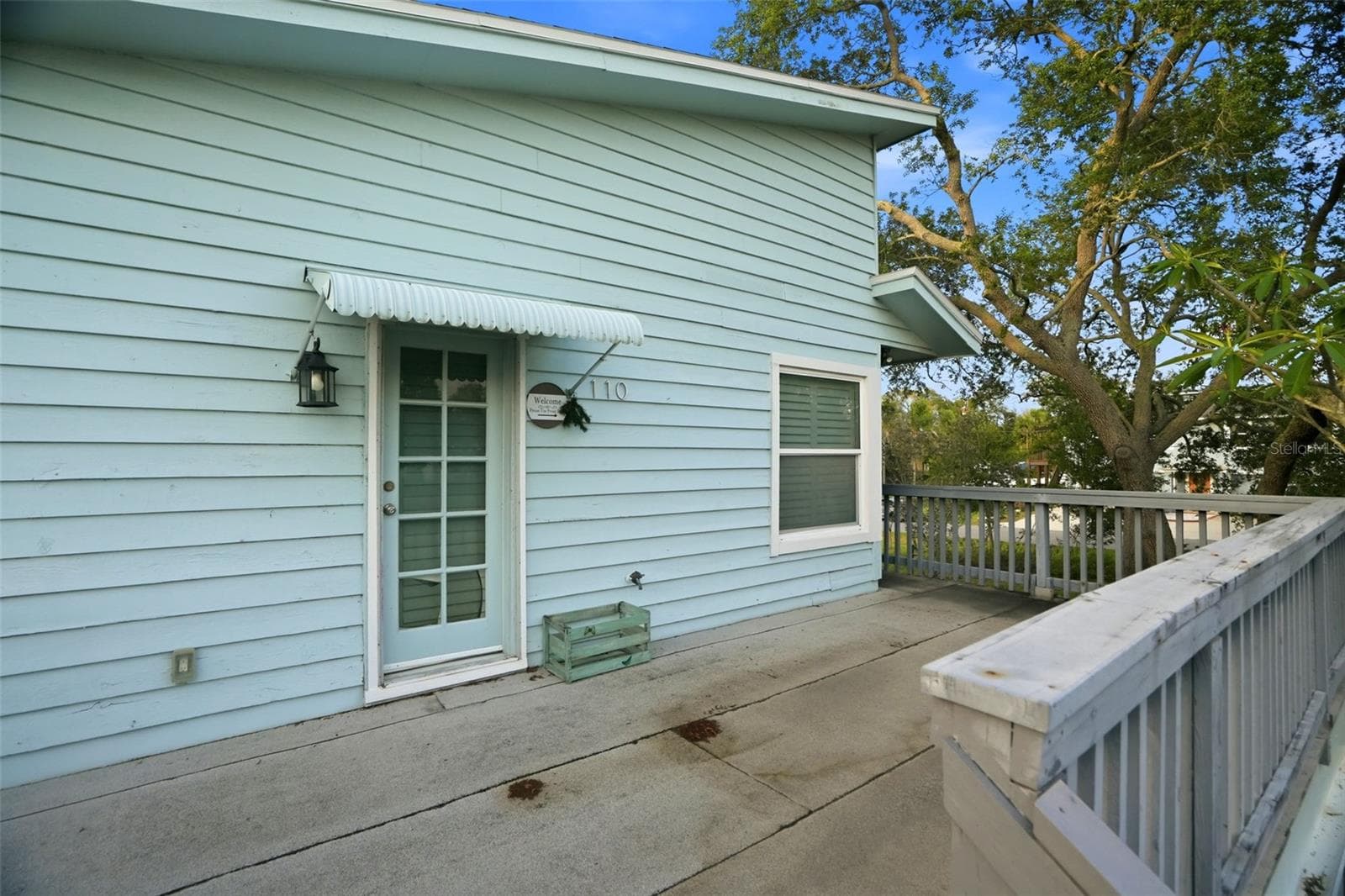 The Key West style home is elevated with decking around the entire home. - 110 GEORGIA AVE. AVE, CRYSTAL BEACH