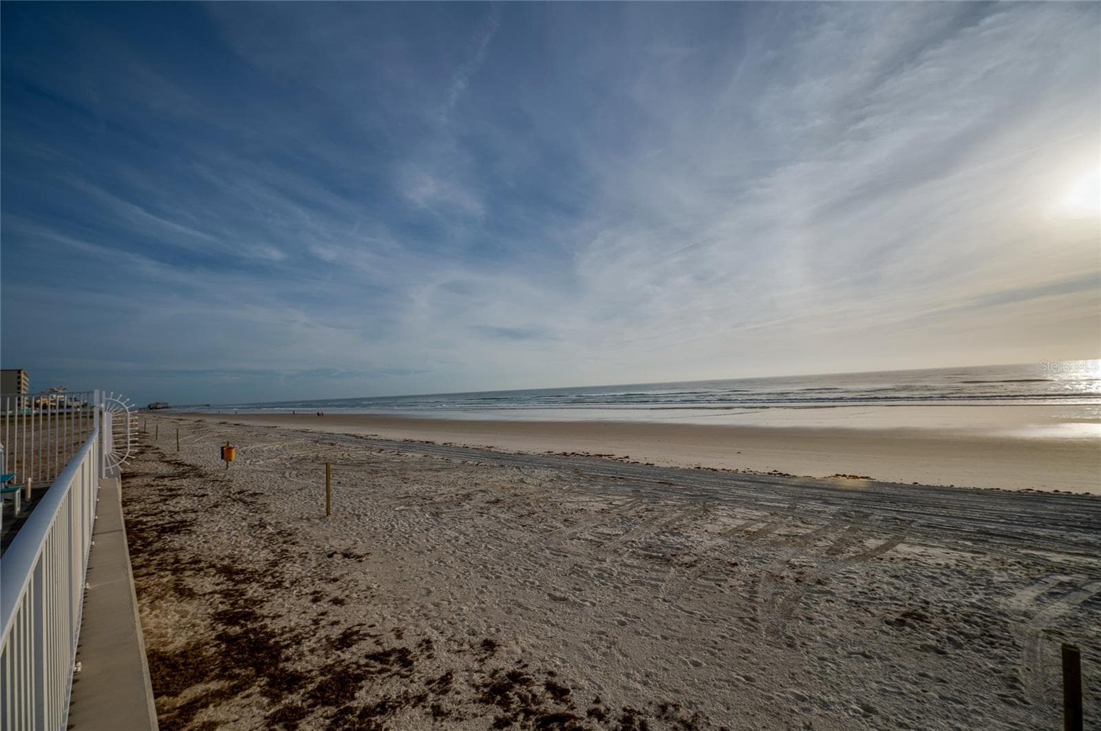 Pristine stretch of sandy beach just steps from the complex, offering a serene setting for long walks, sunbathing, or enjoying the rhythmic sounds of the waves. - 935 S ATLANTIC AVE #165, DAYTONA BEACH