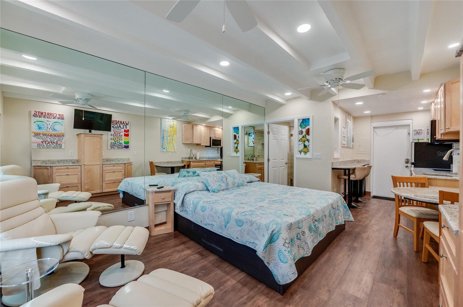 Spacious studio layout with neutral flooring throughout, designed to maximize both seating and sleeping areas for a comfortable coastal retreat. - 935 S ATLANTIC AVE #165, DAYTONA BEACH