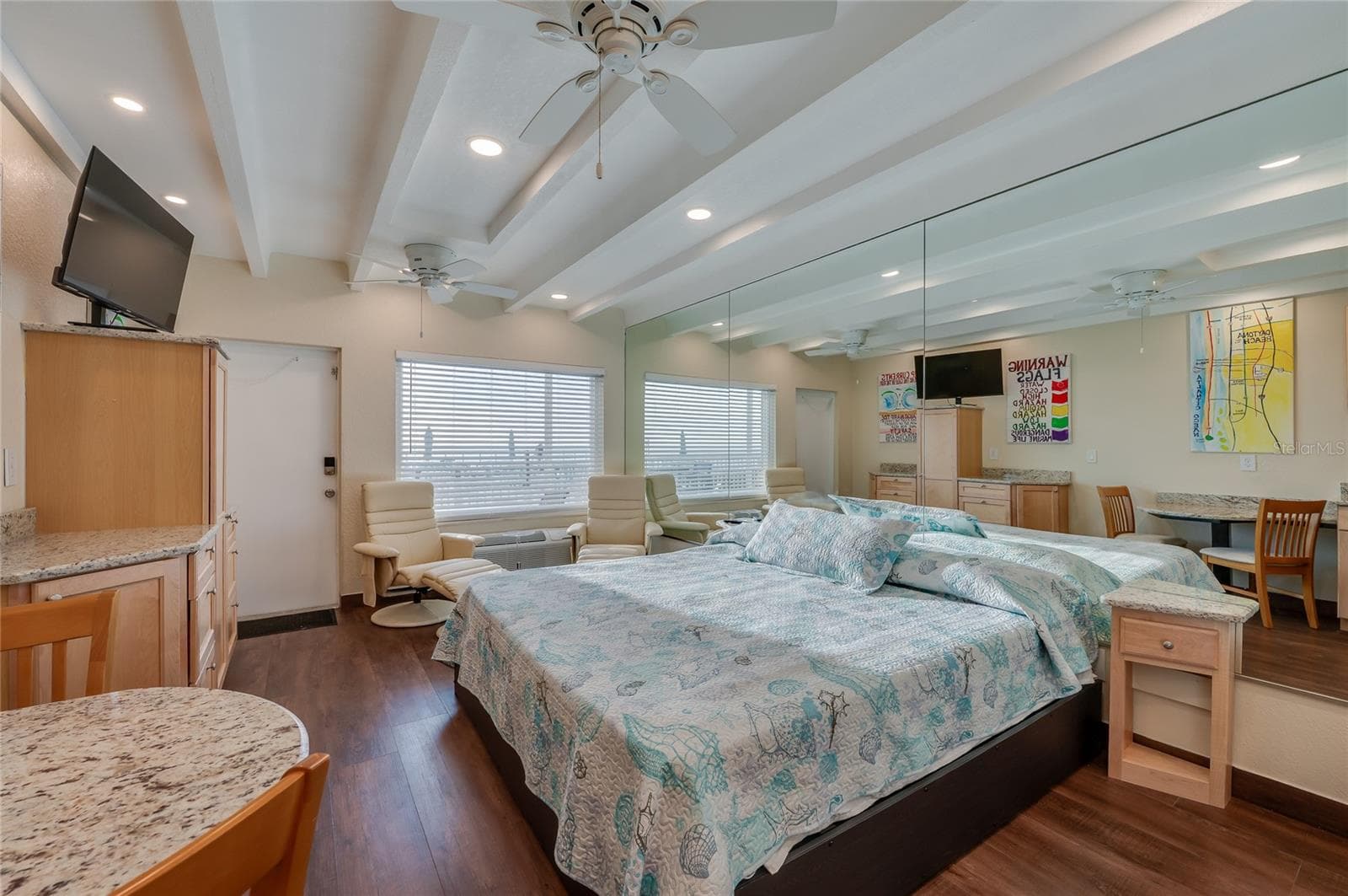 Well-appointed living area with easy access to the patio, blending indoor comfort with outdoor relaxation. - 935 S ATLANTIC AVE #165, DAYTONA BEACH