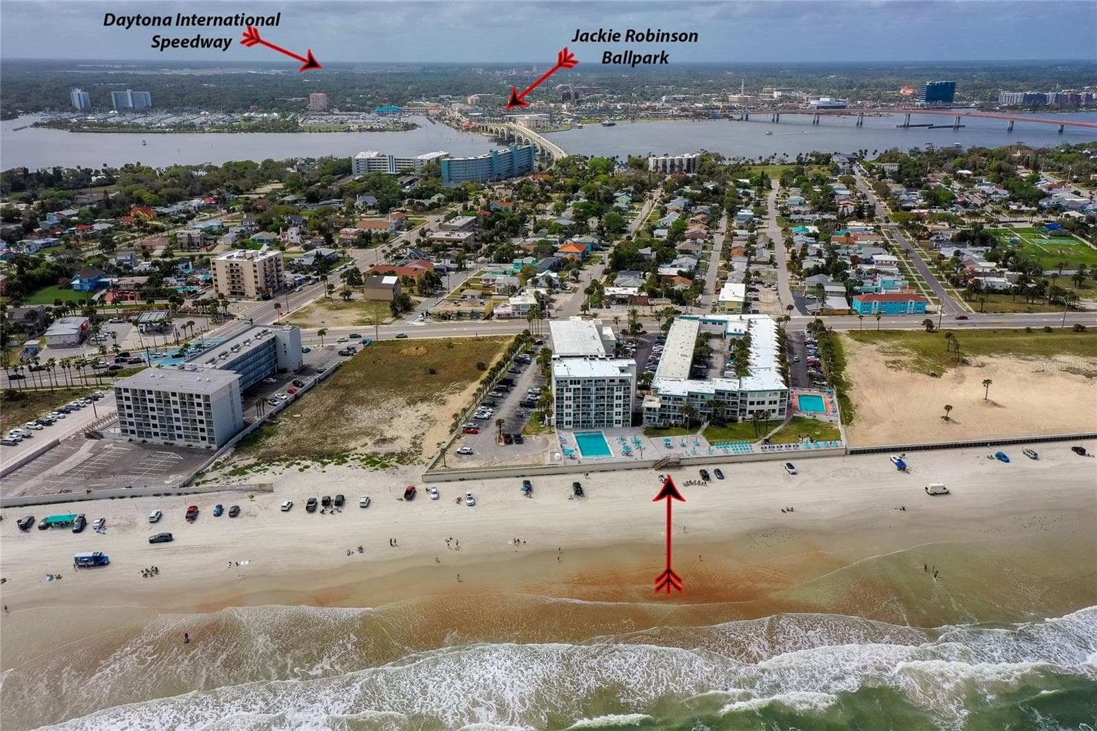A unique overhead angle that captures the architecture of the complex and the surrounding beach environment, emphasizing the property’s scale and coastal charm. - 935 S ATLANTIC AVE #165, DAYTONA BEACH