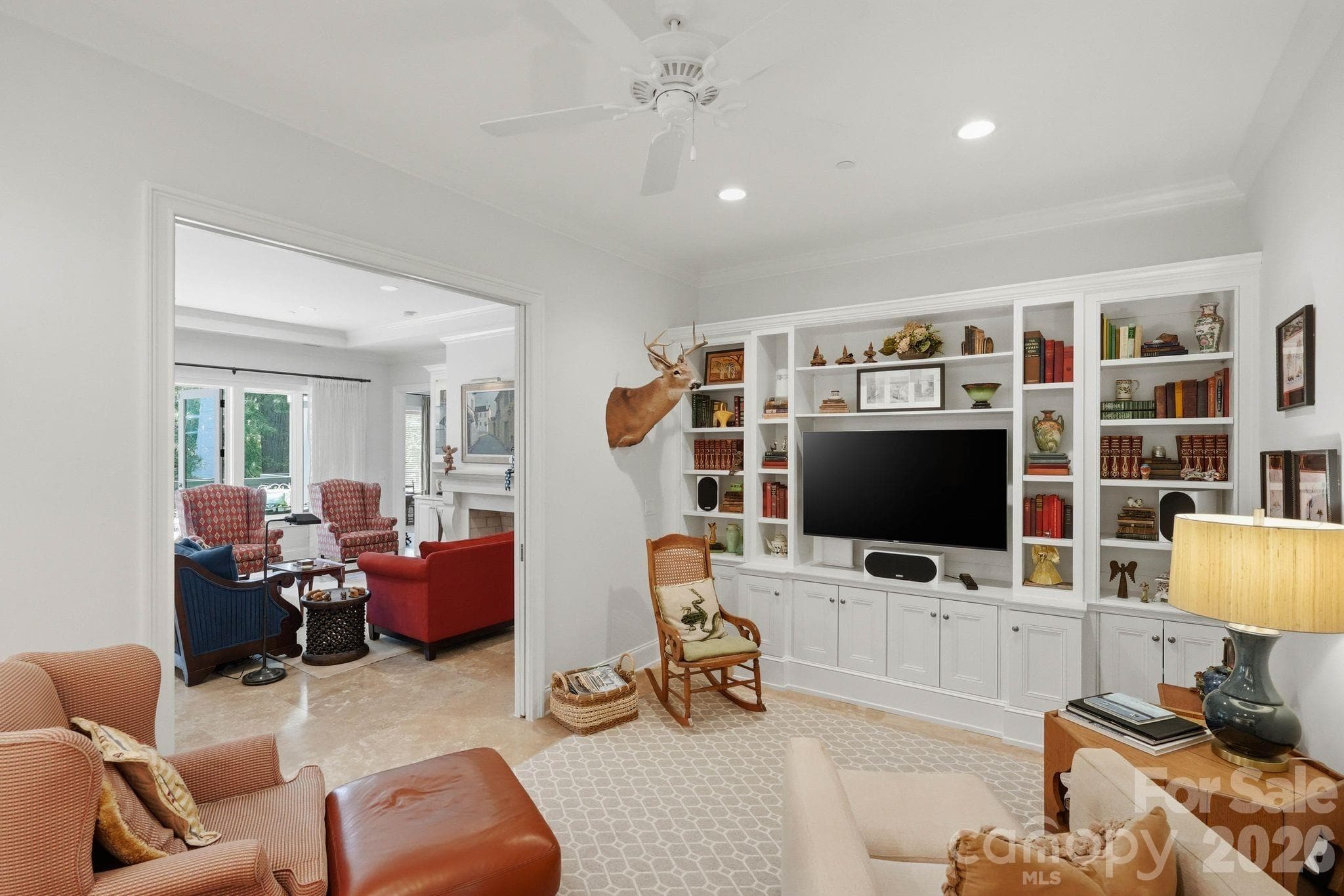 Versatile secondary living space featuring custom built ins and designer details throughout. Perfect as a media room, office, library, or private retreat. - Charlotte