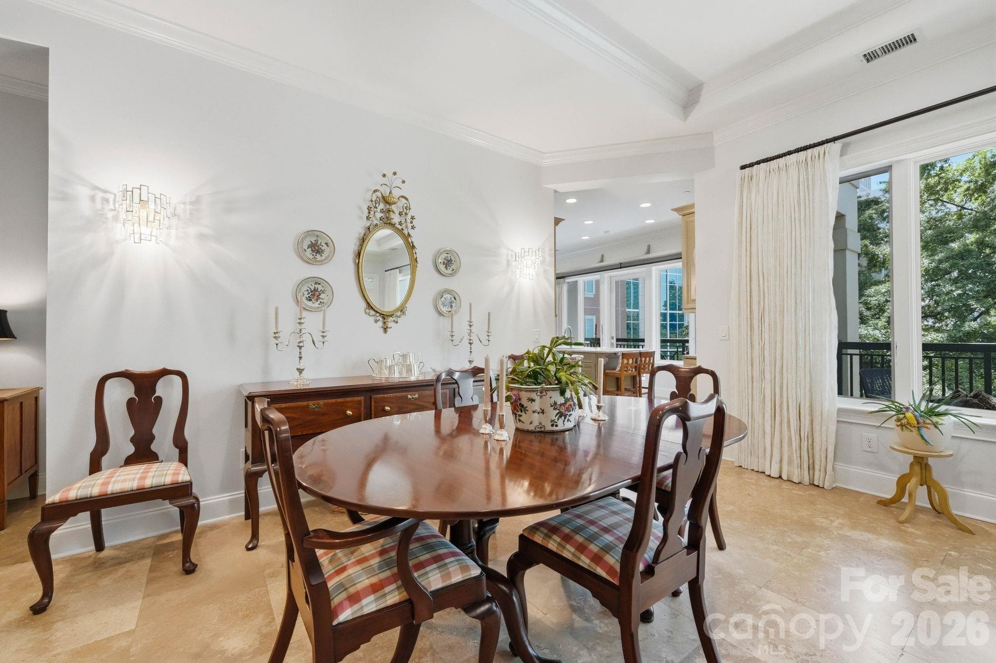 Elegant dining space with refined finishes, soaring ceilings, and seamless flow into the chef’s kitchen and main living areas. Perfect for intimate dinners or entertaining guests in the heart of Uptown Charlotte. - Charlotte