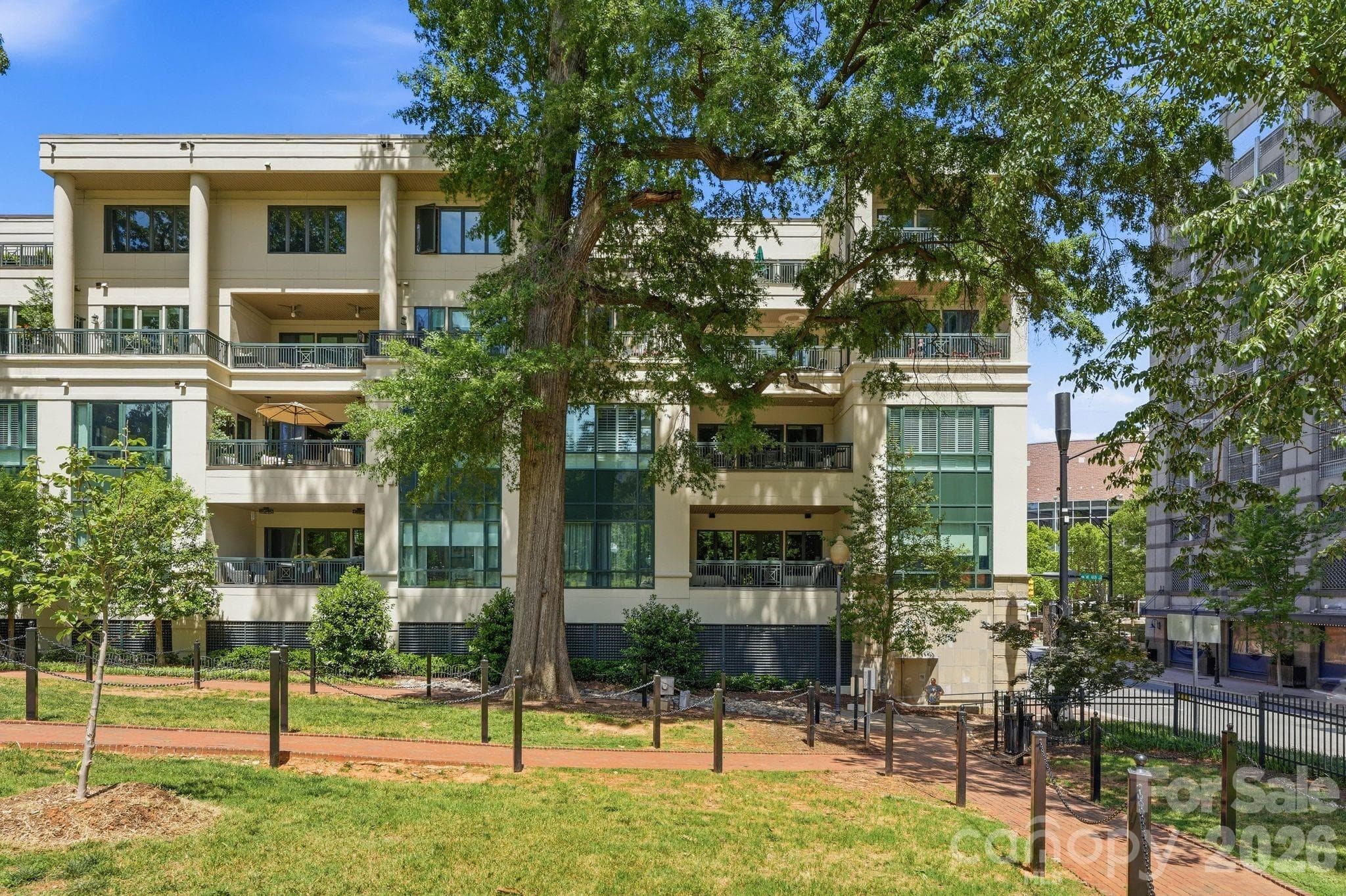 Beautifully positioned alongside Fourth Ward Park, the building offers a rare residential setting surrounded by mature trees and green space in Uptown Charlotte. - Charlotte