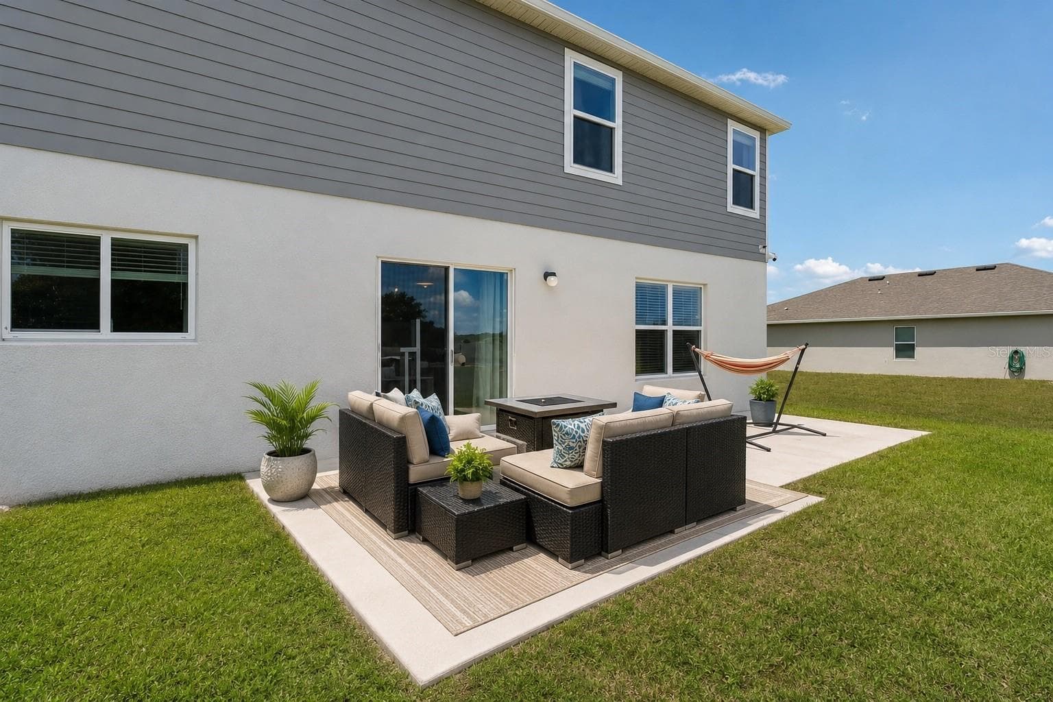 Sliding glass doors open to a patio. - 2082 FICUS ST, MASCOTTE