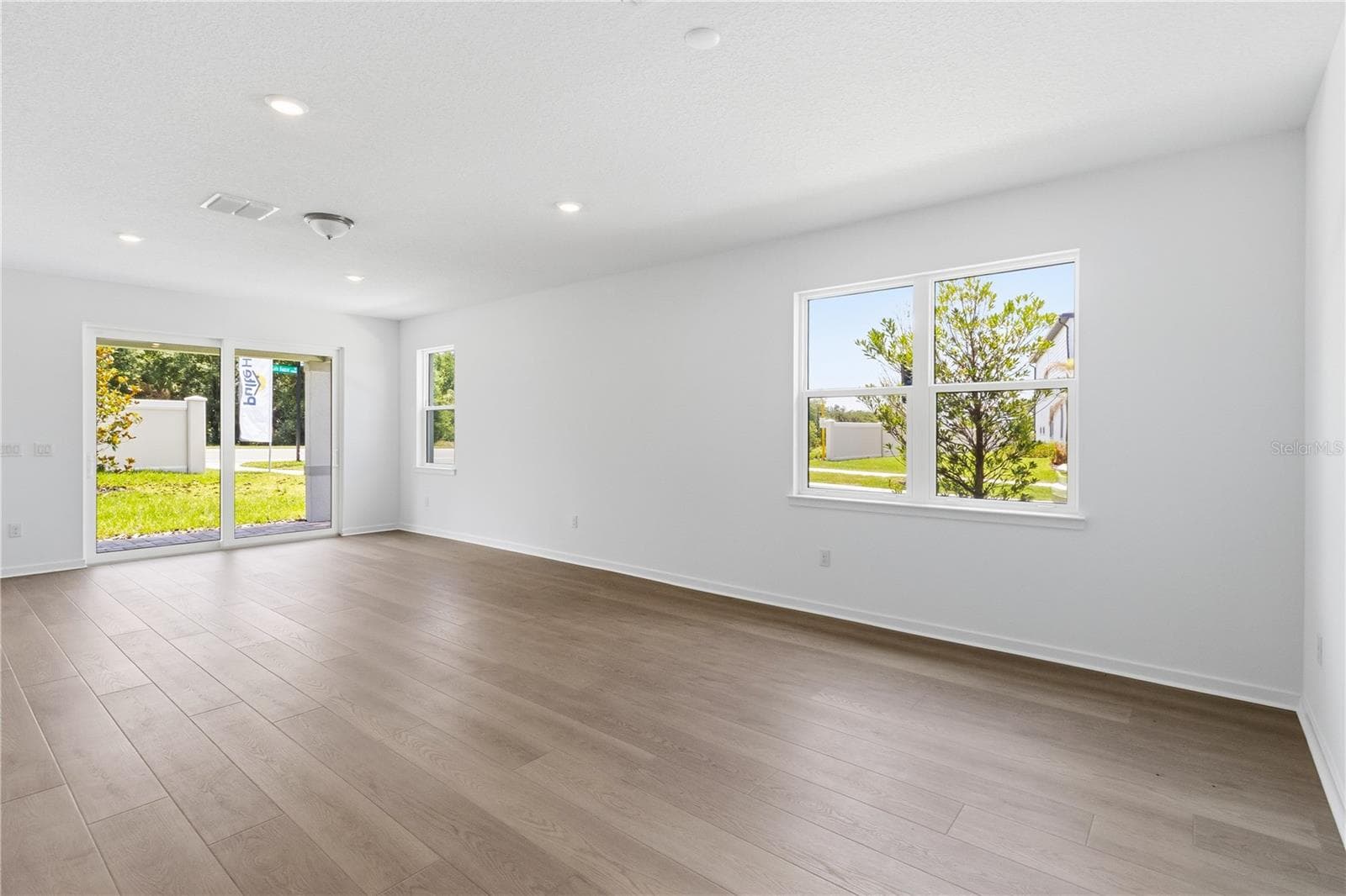 Open gathering room with natural light and flexible space for everyday living. - 13824 SUNLIGHT MEADOW DR, RIVERVIEW