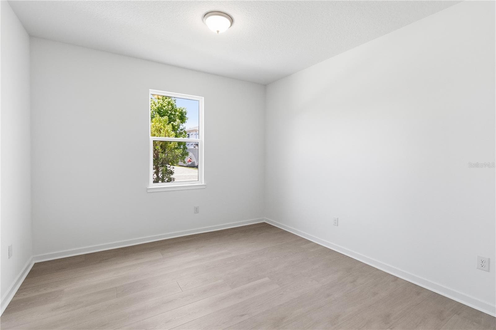 Secondary bedroom with soft natural light and a comfortable, flexible layout. - 13824 SUNLIGHT MEADOW DR, RIVERVIEW
