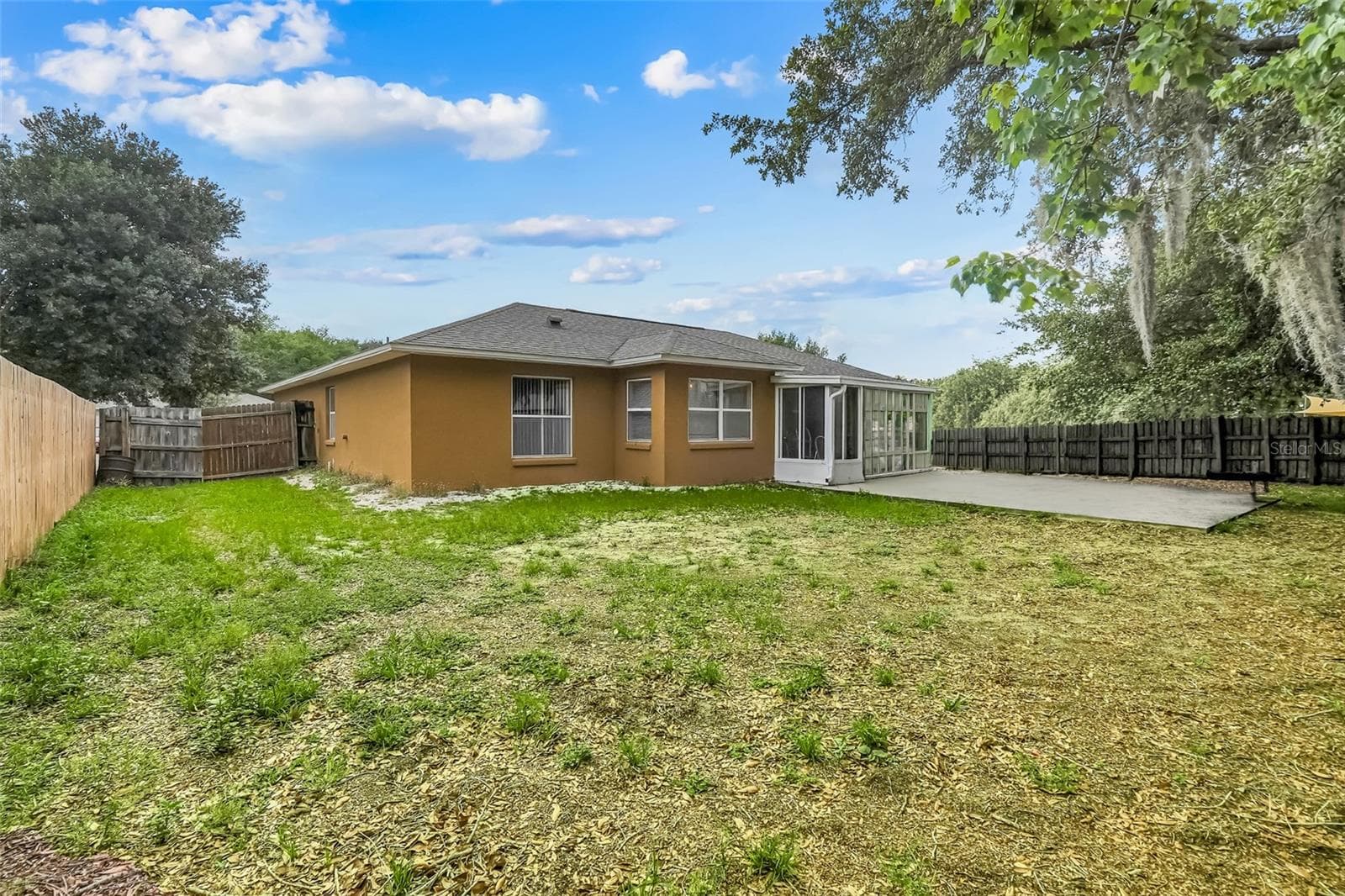 Backyard with extended patio - 10752 CRESCENDO LOOP, CLERMONT