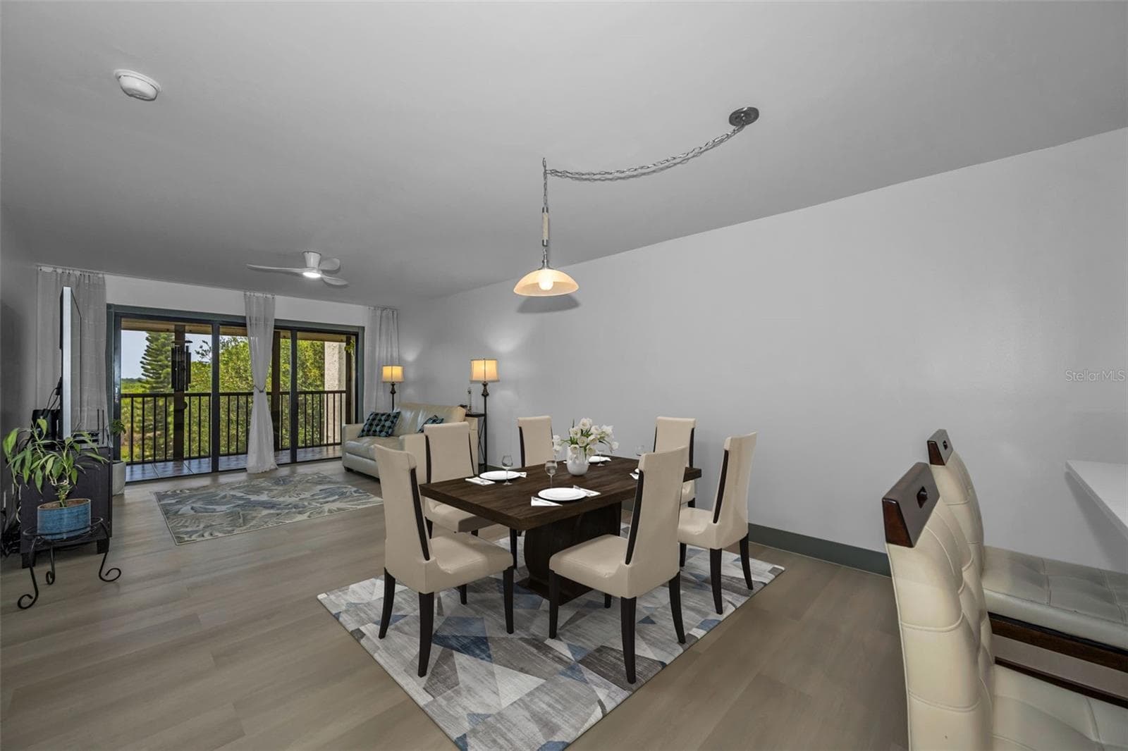 Dining room off living room area, and kitchen bar area. - 5400 PARK ST N #303, ST PETERSBURG