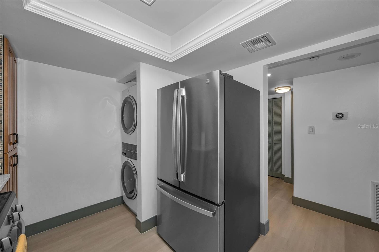 Brand new washer and dry, and refrigerator in kitchen. - 5400 PARK ST N #303, ST PETERSBURG