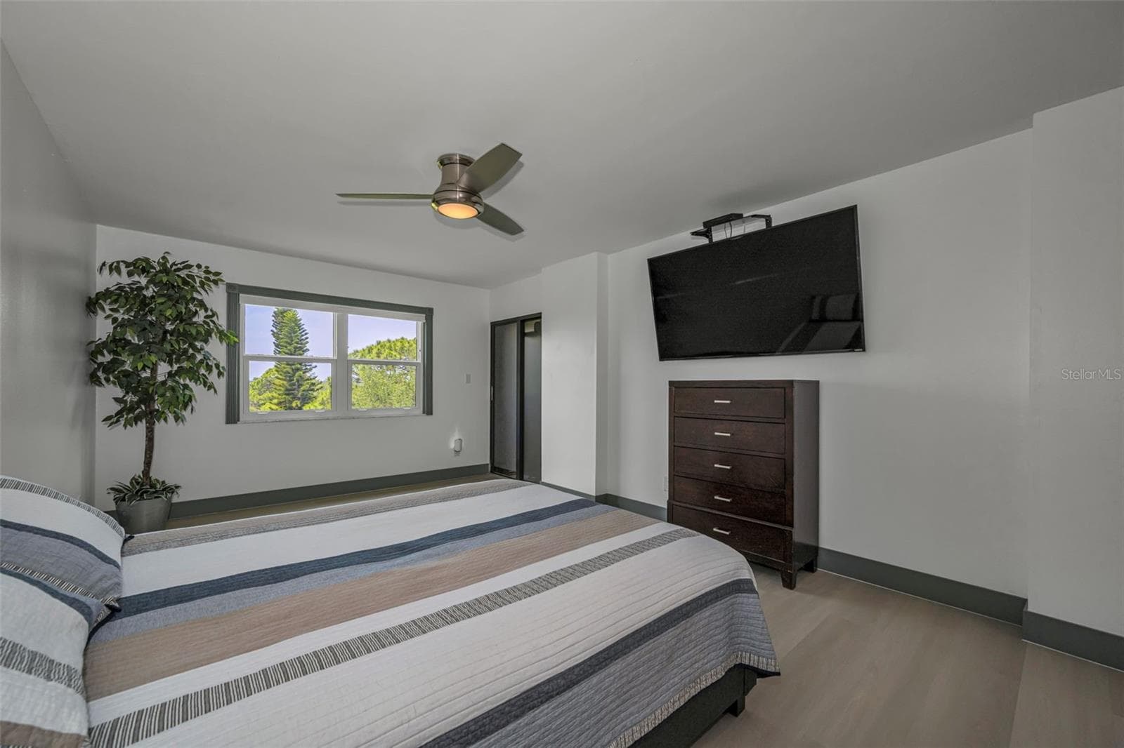 Primary Bedroom, Slider to balcony, new vinyl random plank flooring. - 5400 PARK ST N #303, ST PETERSBURG