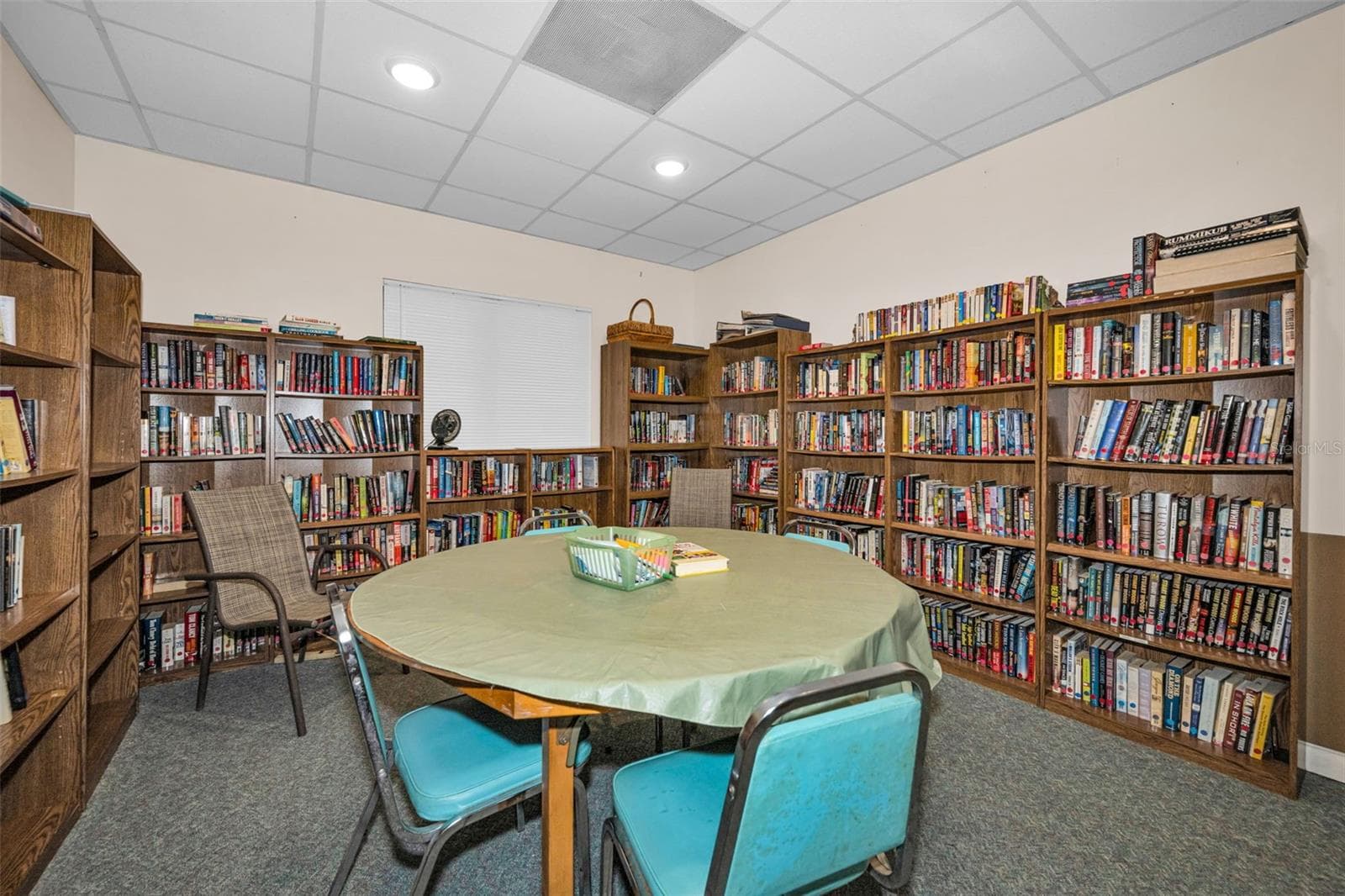 Plenty of books to read at the library in the Association Clubhouse. - 5400 PARK ST N #303, ST PETERSBURG