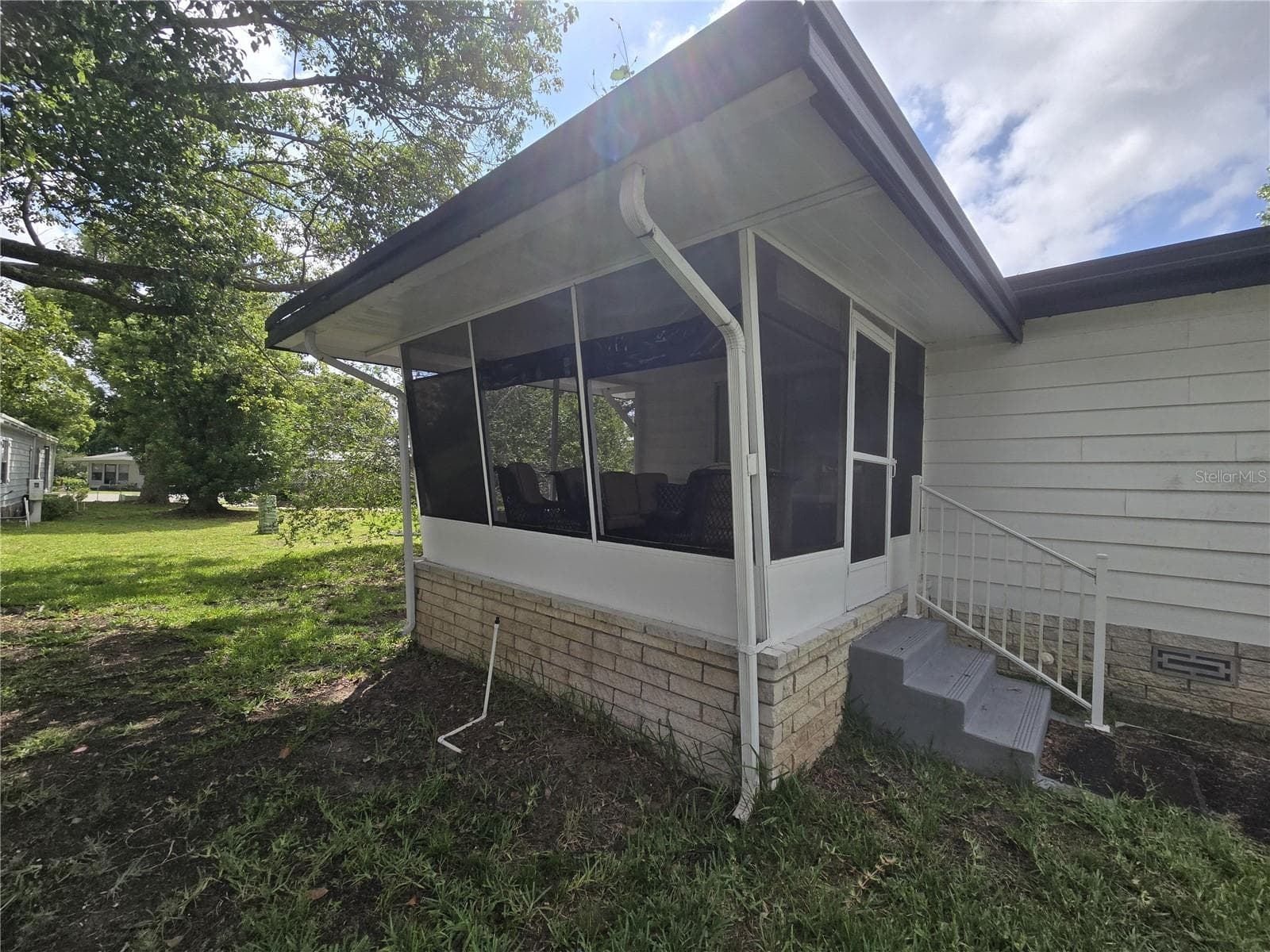 rear patio off primary bedroom - 2011 OAK GROVE DR #39, ZELLWOOD