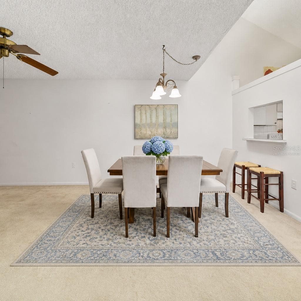 Dining area large enough for full table and 2 barstools(Partially virtually staged - 2415 NE 7TH ST #8, OCALA