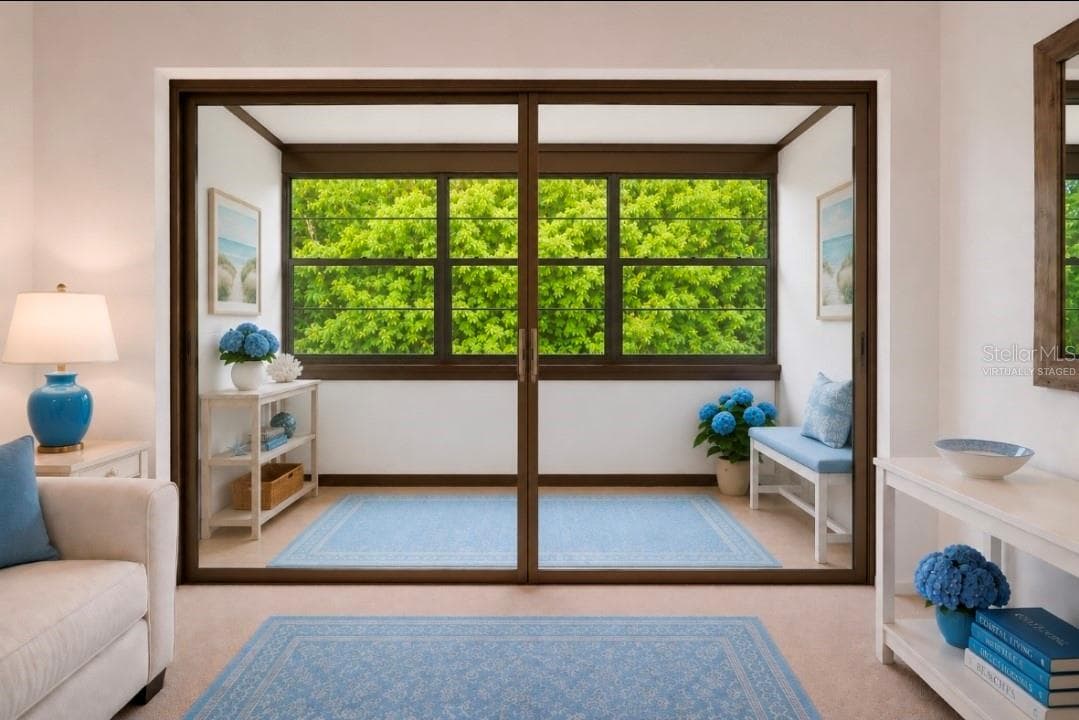 Covered Lanai with big windows,  under roo(Partially virtually stagedf - 2415 NE 7TH ST #8, OCALA