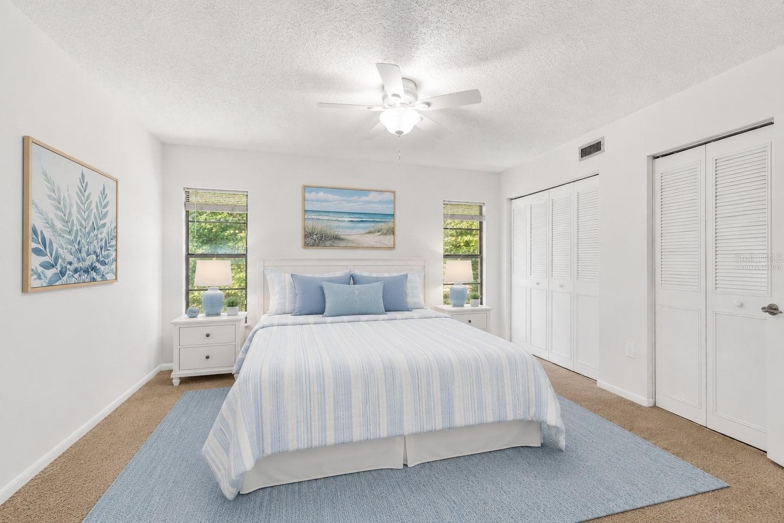 Primary bedroom,  2 closets(Partially virtually staged - 2415 NE 7TH ST #8, OCALA