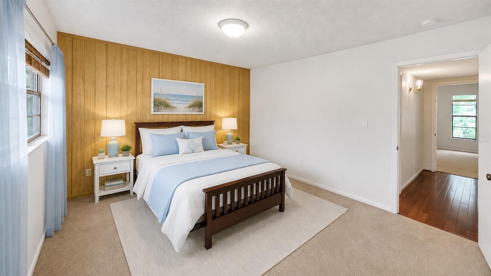 Guest bedroom, accent wall and triple windows(Partially virtually staged - 2415 NE 7TH ST #8, OCALA