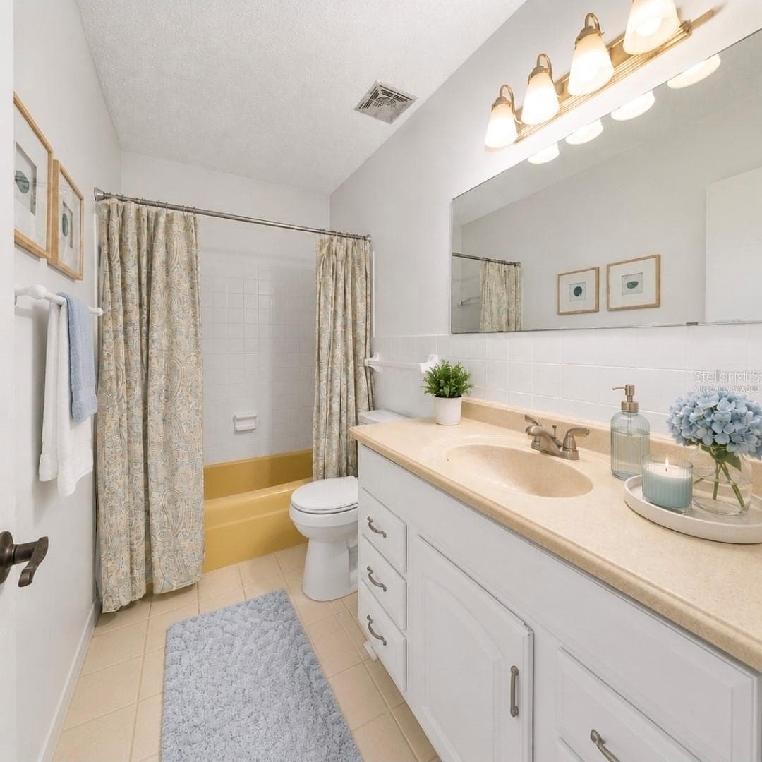 Guest bathroom.  (Partially virtually staged - 2415 NE 7TH ST #8, OCALA