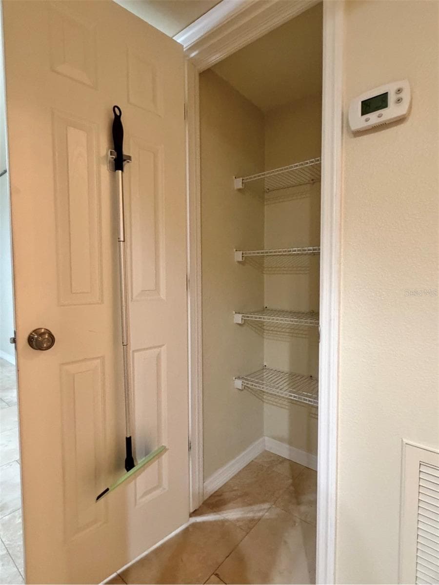 A hallway storage closet or pantry. - 3815 N OAK DR #G71, TAMPA
