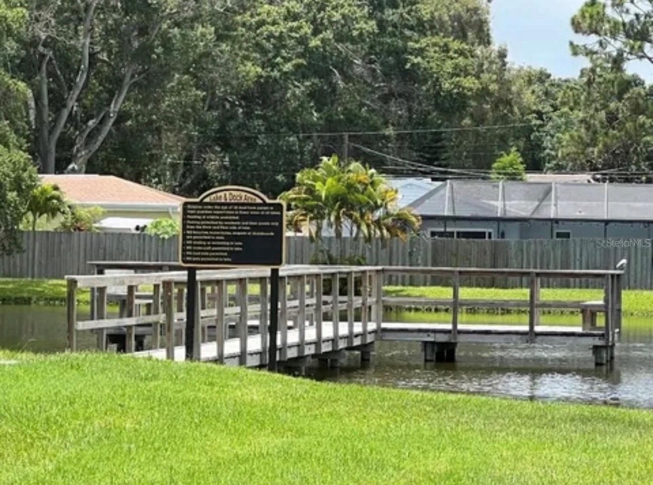 Enjoy the beautiful lake in the back of the community with a dock and seating areas. Fishing is permitted. - 3815 N OAK DR #G71, TAMPA