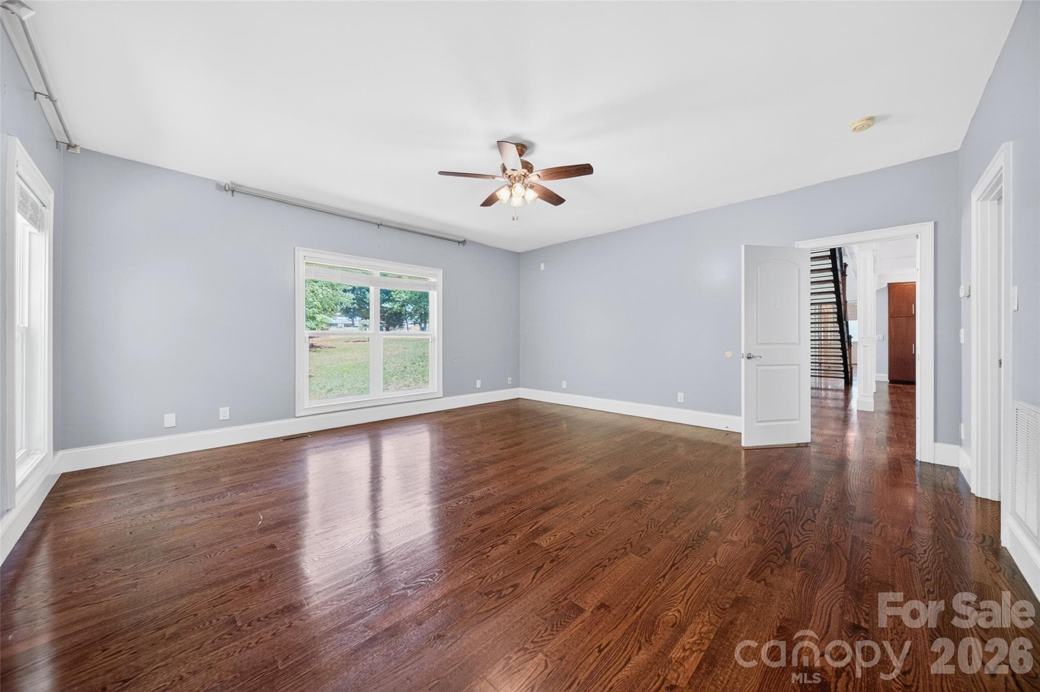 Primary bedroom on Main level features wood floors - 2977 Cabin Creek Drive, Catawba