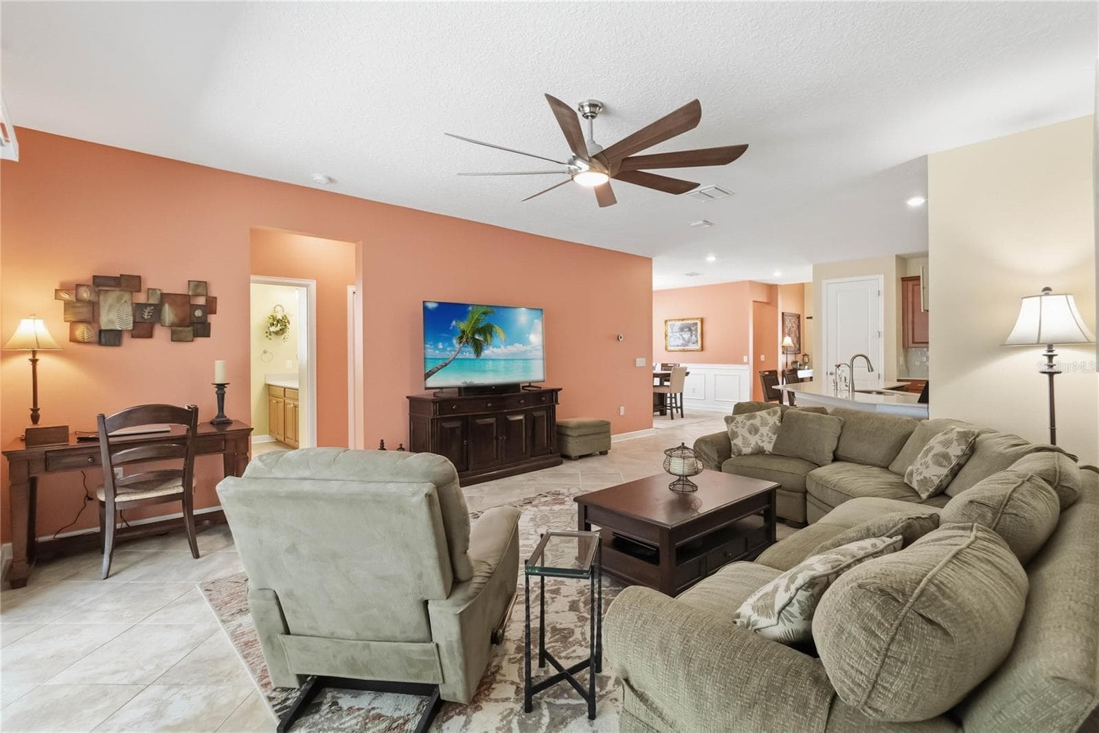 open concept family room to kitchen and dining areas - 1361 OLYMPIC CLUB BLVD, CHAMPIONS GATE