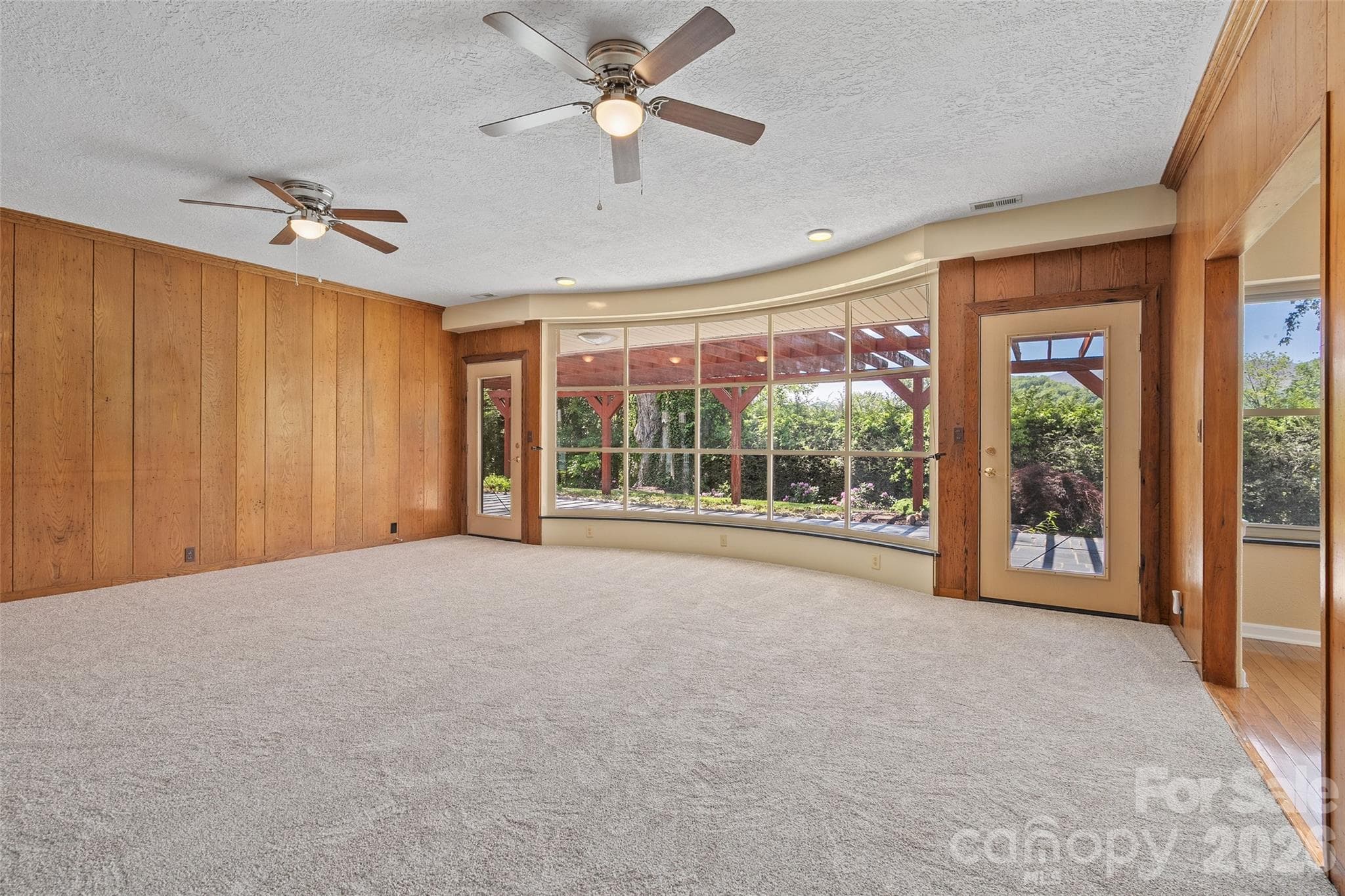 Living Room with walkout to the back deck. - Waynesville