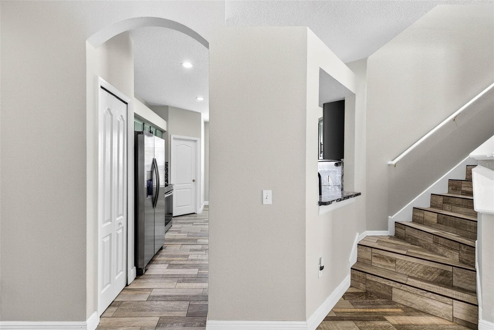 Kitchen, stairs to the bonus room - 10024 COLDWATER LOOP, LAND O LAKES