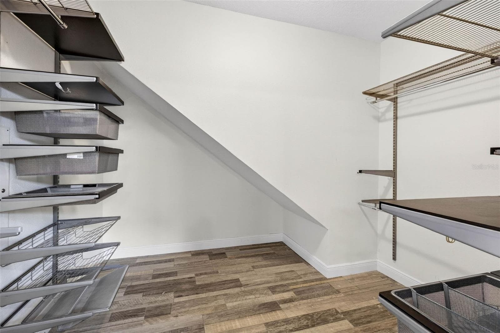 Primary bedroom walk in closet - 10024 COLDWATER LOOP, LAND O LAKES