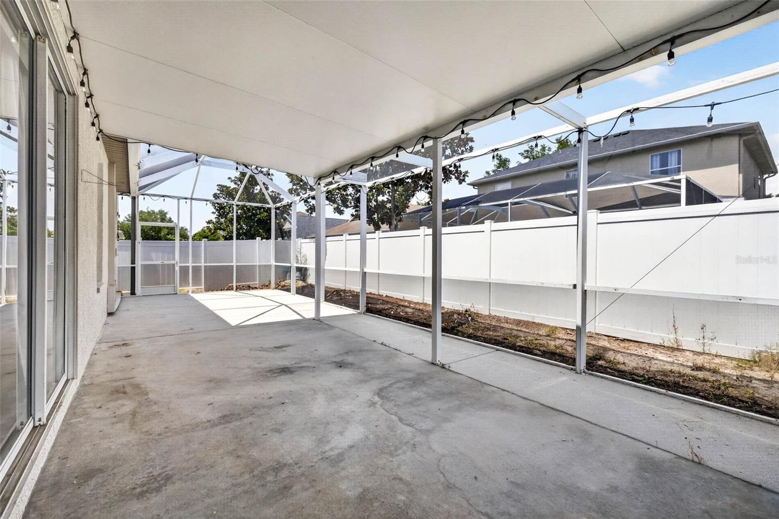 Large back porch covered and screened - 10024 COLDWATER LOOP, LAND O LAKES