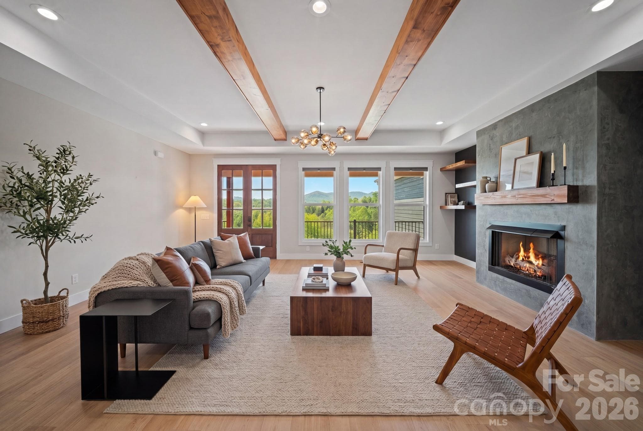 Spacious living room with a beautiful fireplace and mountain views (virtually staged) - 111 Pisgah Gap Drive, Candler