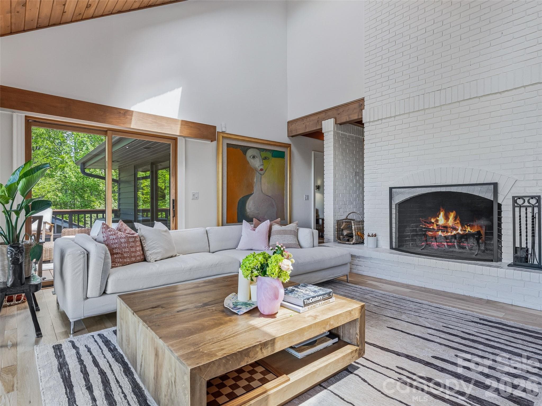 Imagine gathering with loved ones around the blazing fireplace, perfect for both entertaining and for cozy nights in. - 100 Big Spring Drive, Asheville