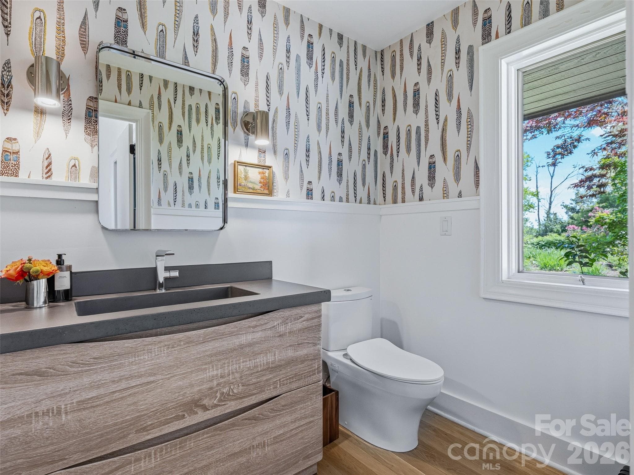 Powder room featuring Hygge & West "Plume" wallpaper, conveniently located in the foyer. - 100 Big Spring Drive, Asheville
