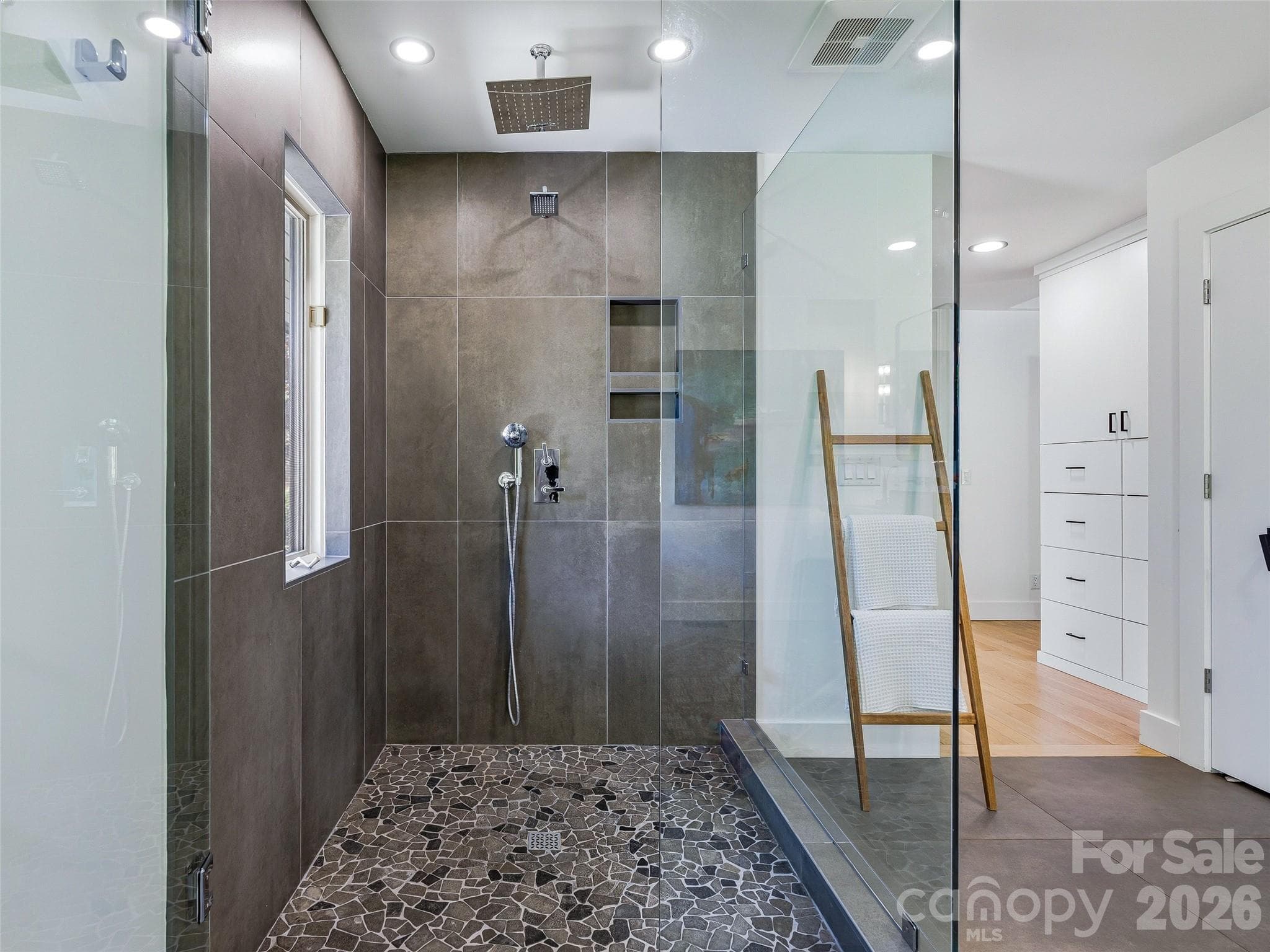 Frameless glass corner shower with House of Rohl rainfall, fixed, and handheld shower heads. - 100 Big Spring Drive, Asheville