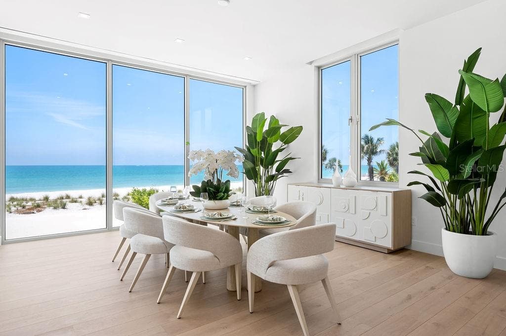 Dining area is surrounded by 11 foot impact glass windows and sliders - 6489 GULFSIDE RD, LONGBOAT KEY