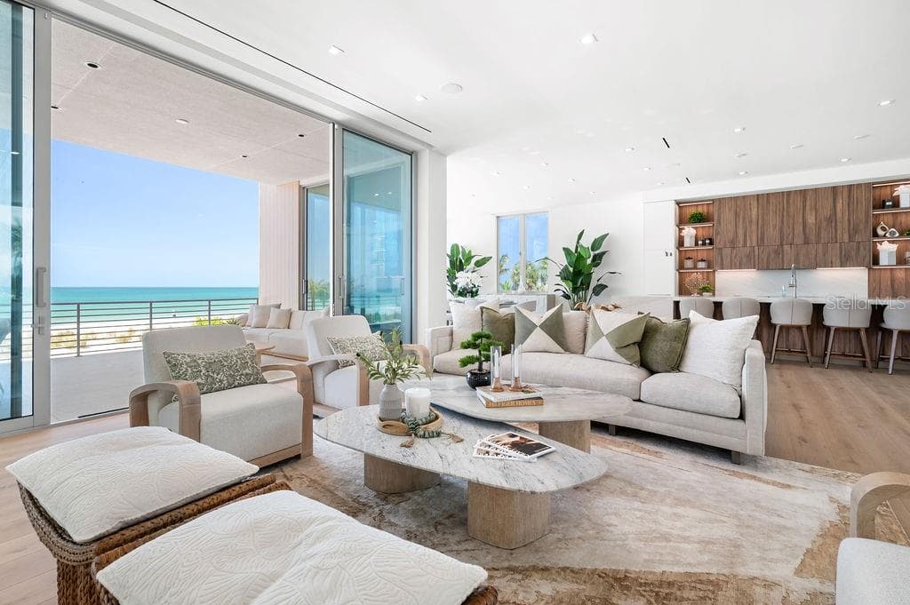 Open living space includes a vapor fire place to designate additional club room - 6489 GULFSIDE RD, LONGBOAT KEY