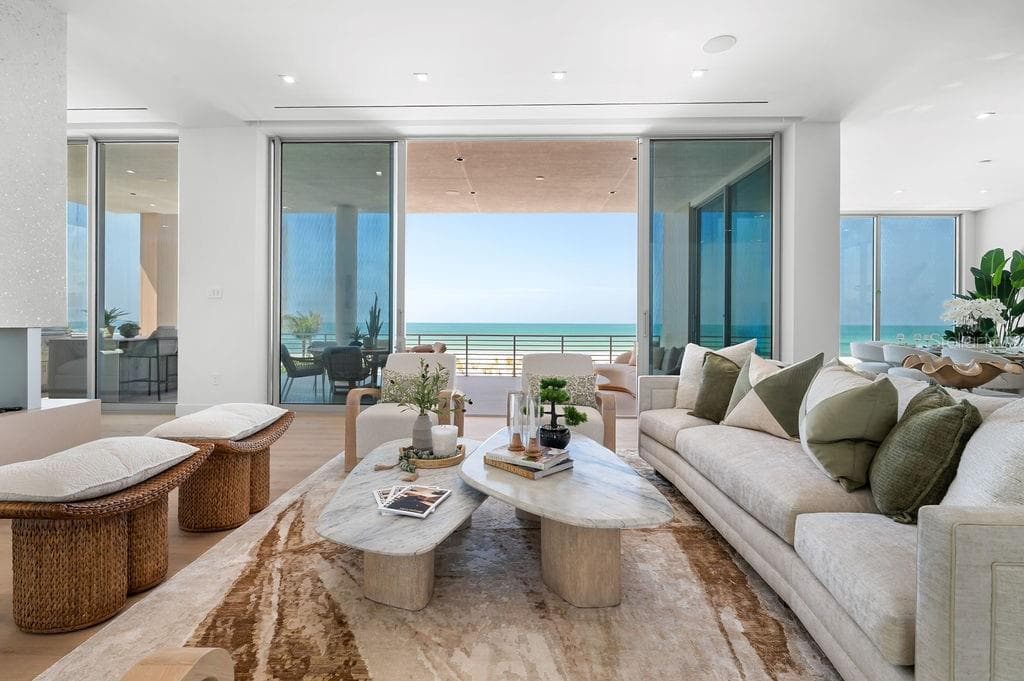 Open living space features a vapor fireplace, opening to the 40 foot terrace - 6489 GULFSIDE RD, LONGBOAT KEY