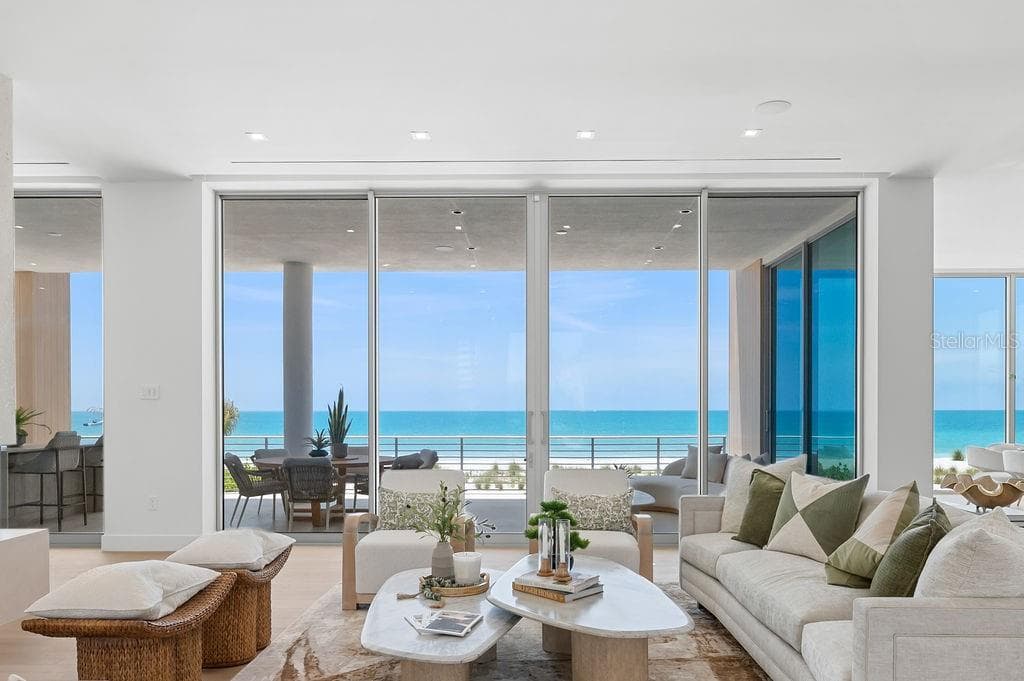 Open living space features a vapor fire place to designate additional club room - 6489 GULFSIDE RD, LONGBOAT KEY