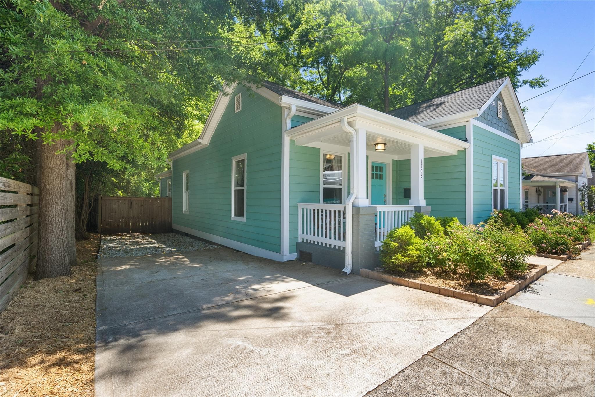 Large driveway allows for parking of 2+ cars. - Charlotte