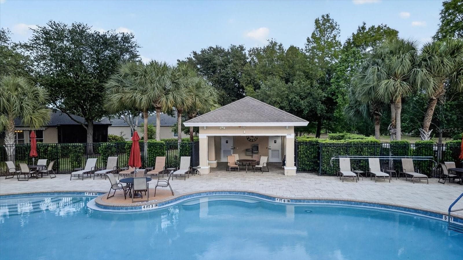 Gulfwinds residents enjoy access to the community swimming pool. - 2153 BARRACUDA CT, HOLIDAY